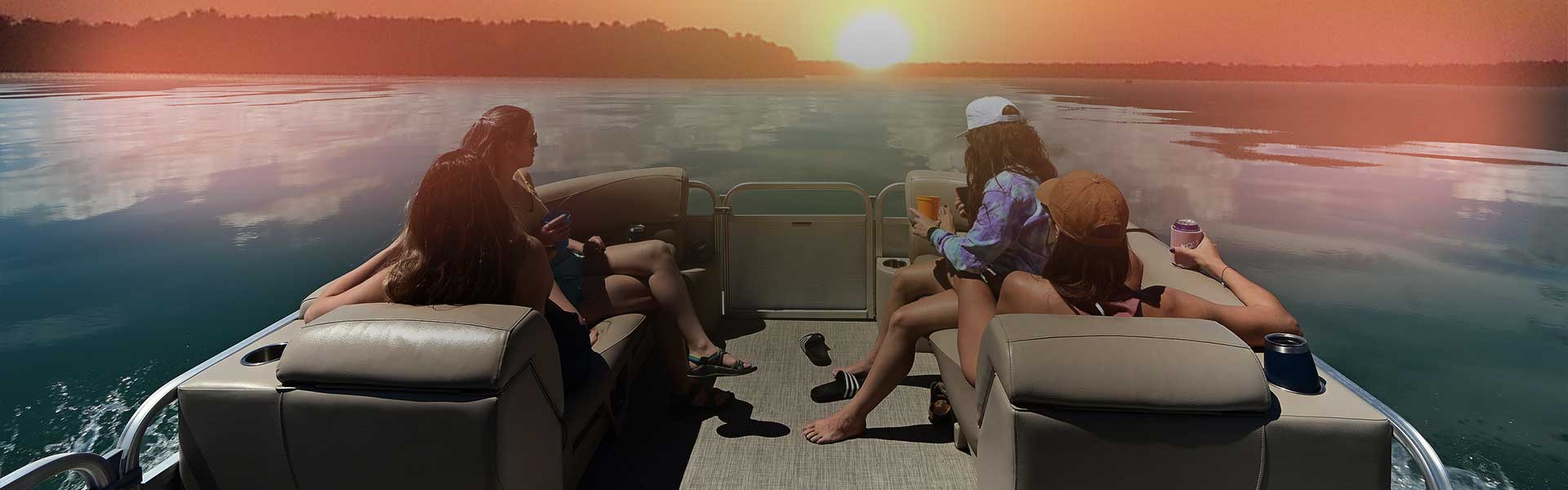 Boaters crusing the Crystal Rock Lake sunset in Wisconsin on a Big Papa's Pontoon Boat Rental